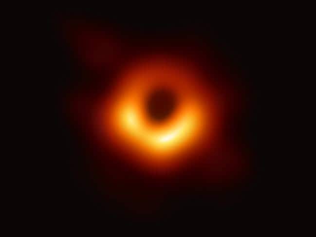 The first photograph of a black hole and its fiery halo, released by Event Horizon Telescope astronomers (EHT), which is the &quot;most direct proof of their existence.&quot; Picture: AFP
